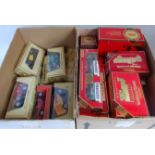 Two boxes containing a large quantity of various boxed and window boxed Matchbox Models of