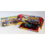 A Corgi Toys No. 267 rocket firing Batmobile comprising of gloss black body with gold and red Bat