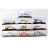 Ten various plastic cased 1/43 scale Minichamps racing diecasts to include a Lancia Delta Integral