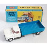 A Corgi Toys No. 483 Dodge Kew Fargo tipper, comprising of white cab and blue back with red interior