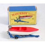 A Matchbox No. 48 trailer with removable sports boat, comprising of blue trailer with white and