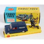 A Corgi Toys No. 448 BMC Mini Police Van with tracker dog, comprising of dark blue and red body with