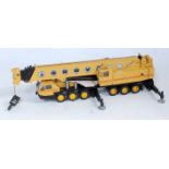 An NZG No. 152 1/50 scale model of a TM1500 Grove 6 axle construction crane, finished in yellow