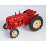 A Lesney Moko series No. 745D Massey Harris tractor comprising red body with cream hubs, and