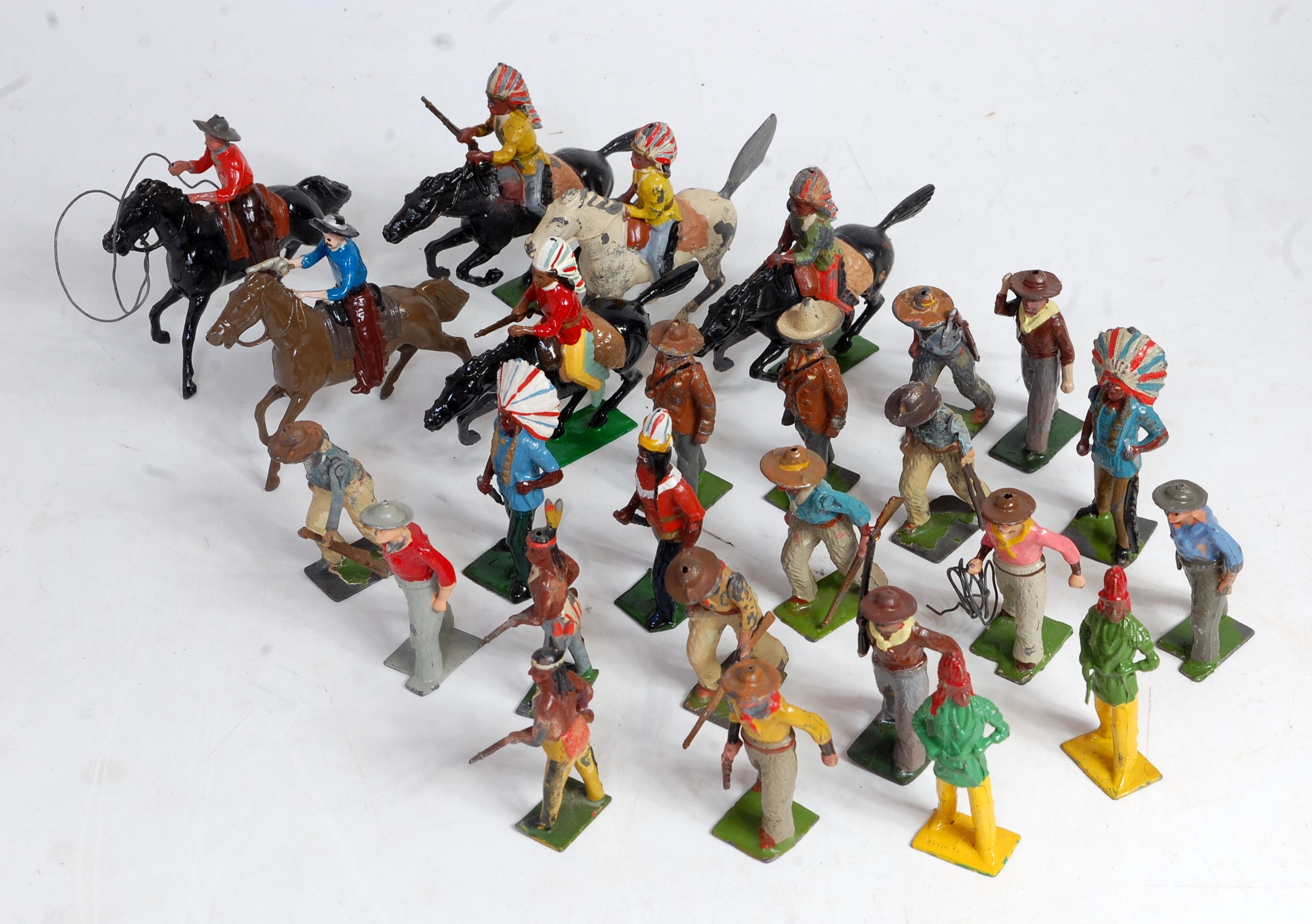 A Britains loose lead and hollow cast Cowboys & Indians series figure group to include cowboys on