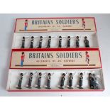 A Britains set No. 312 Grenadier Guards in winter coats, one example comprising of marching