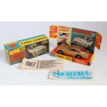 A Corgi Toys No. 261 James Bond Aston Martin DB5 comprising of gold body with red interior and