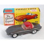 A Corgi Toys No. 307 E-type Jaguar with detachable hard top comprising of metallic dark grey body