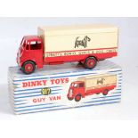 A Dinky Toys No. 917 Spratts guy van comprising red and cream body with red Supertoys hubs and