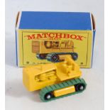 A Matchbox No. 8 Caterpillar tractor, comprising of yellow body with green tracks in the original