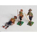 Three various loose Britains boy scout figures to include boy scout standing with axe, two walking