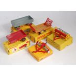 Five various boxed Dinky Toys trailers and accessories to include No. 428 trailer, No. 320 harvest