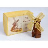 FG Taylor & Sons No. 531 windmill comprising of brown and silver body with yellow sails in the