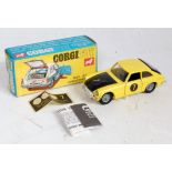 A Corgi Toys No. 345 MGC GT competition model comprising of yellow and black body with wire work