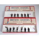 Two replica Britains boxes containing a quantity of original Britains soldiers, examples to