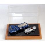 A white metal and resin Mercedes race car transporter and load diorama group to include a Vroom Kits