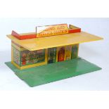 A Dinky Toys No. 48 pre-war filling and service station comprising of a yellow tinplate building