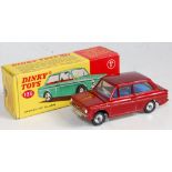 A Dinky Toys No. 138 Hillman Imp saloon comprising of metallic red body with blue interior and