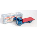 A Dinky Toys No. 512 guy flat truck, comprising dark blue cab and chassis with light blue hubs and