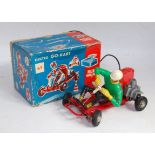 A Huki No. DM12.80 plastic and battery operated go-kart comprising of red body and chassis, with