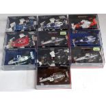 Ten various plastic cased Minichamps 1/43 scale F1 racing diecasts to include a Niki Lauda 1984