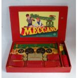 An original Meccano Outfit No. 7 1950s red & green gift set, appears complete and strung to