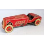A Wells or Mettoy large scale British made tinplate clockwork racing car comprising of red, cream