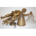 A cast and gilt metal ceiling pendant in the form of a cherub, with moulded glass shade together