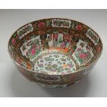 A large Chinese famille rose bowl, typically decorated with various figures within interiors, with