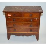 A mahogany apprentice piece chest of two short over three long drawers and shaped apron, w.38cm