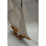 A modern scratch-built yacht, having full sails and rigging, h.92cm
