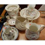 A Victorian wash-jug and bowl, on a plain white ground with pink rose decoration, heightened in