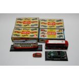 A collection of boxed Merit racing car assembly kits, together with a London Transport bus etc