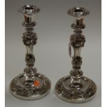 A pair of silver plated table candlesticks, in the Rococo style, each having a removable sconce,