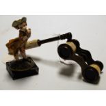 A pair of early 20th century mother of pearl opera glasses together with continental figure of a