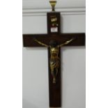 A contemporary oak and brass wall mounted crucifix