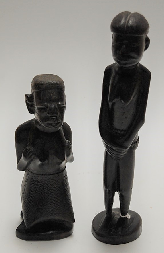 A mid-20th century carved hardwood Tribal fertility figure, h.27cm together with one other (2)