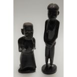 A mid-20th century carved hardwood Tribal fertility figure, h.27cm together with one other (2)