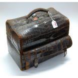 A Victorian crocodile skin travel case, the side compartment having black folding mirror and two ink