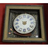 A 19th century French clock, the marble dial with raised enamelled Roman numerals, housed in a black