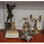 A late 19th century French gilt metal figure of a cherub, in standing pose, with hoop and dog at his