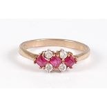 A 9ct gold, ruby and diamond set dress ring, 2.1g, size M