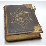 A Victorian leather bound and brass mounted Holy Bible, with the commentaries of Scott and Henry
