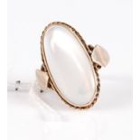 A yellow metal (unmarked but tests as approx 9ct) and moonstone set dress ring, of good size, the
