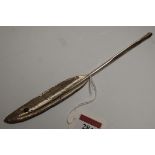 A circa 1900 white metal and hardstone inset quill holder in the form of a feather, length 21.5cm