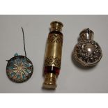 A Victorian silver gilt and cranberry glass double ended scent bottle, the central silver gilt