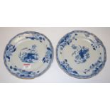 A pair of 18th century Chinese export blue & white plates (one with rivet repairs), dia. 22cm (2)