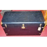 A black painted, brass bound luggage chest, width 100cm