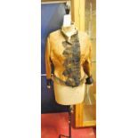 An early 20th century tailor's dummy raised on black painted tubular metal base, with blouse, height