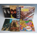A collection of seven Beatles LP's